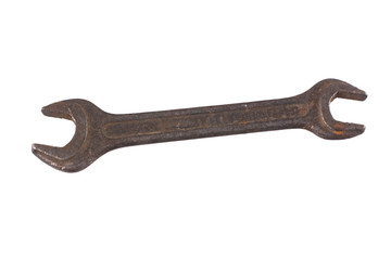 Old rusty wrench isolated on a white background.