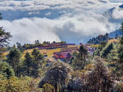 At the top of Taksindu La pass. Beautiful above-clouds view. Everest base camp trek: way from Kharikhola to Taksindu. Himalayas, Solokhumbu, Nepal.