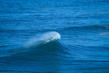 Naklejka premium Perfect wave breaking perfectly in Nazare Portugal