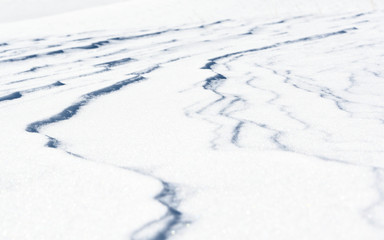 Fototapeta na wymiar Fresh snow background texture. Winter background with snowflakes and snow mounds.