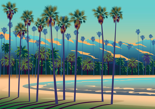 A Tropical beach in California with palm trees, ocean, and mountains in the background.