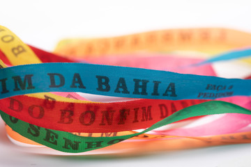 Lucky bracelets typical of Bahia, Brazil (Lembrança do Senhor do Bonfim da Bahia). Translation:...