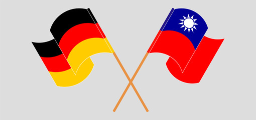 Crossed and waving flags of Taiwan and Germany