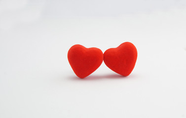 two red hearts on a white background
