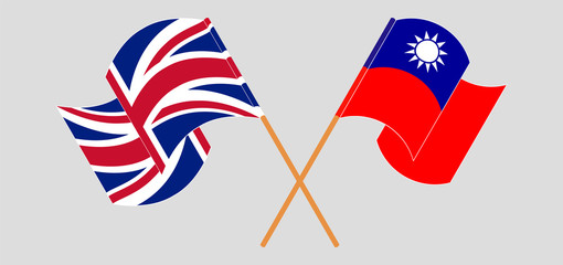 Crossed and waving flags of Taiwan and the UK
