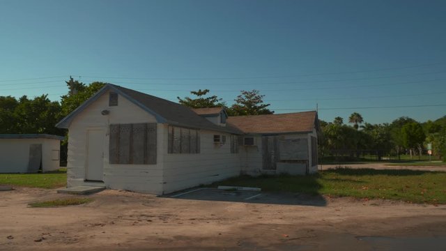 Boarded up abandoned house motion footage