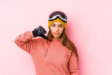 Young caucasian woman wearing a ski clothes isolated showing a dislike gesture, thumbs down. Disagreement concept.