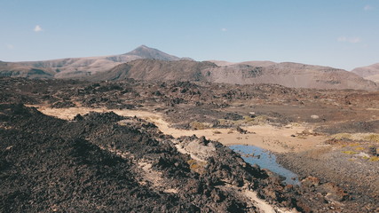 sunset between mountains cliffs and desert landscapes