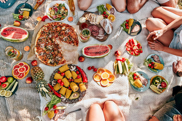 Blanket with food prepared for summer picnic outdoors