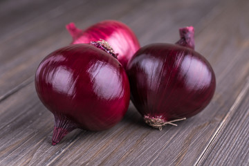 red onions on rustic wood