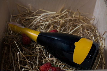 gift bottle of sparkling wine, packed with strawberries