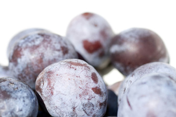 Close up shot of plums in a bowl