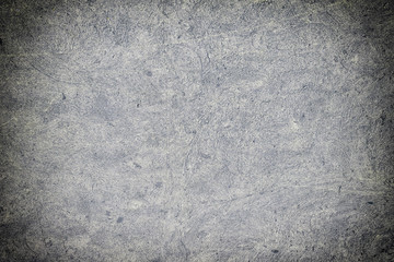 Abstract dark gray background with concrete texture. Toned photo for sites and layouts with vignette.