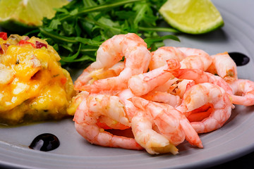 Shrimp close-up. Mango and hot pepper chutney sauce. Tasty national dinner. Selective focus.