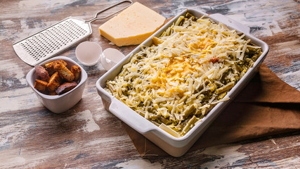 Food banner Vegetable lasagna with green beans and cheese in a ceramic bowl. Healthy vegetarian...