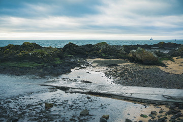 Fototapeta na wymiar Shore and rocks at Elie's Beach, Fife, Scotland