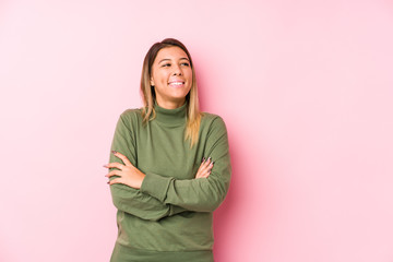 Fototapeta premium Young caucasian woman posing isolated smiling confident with crossed arms.