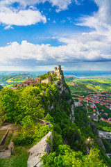 San Marino, medieval tower on a rocky cliff and panoramic view of Romagna