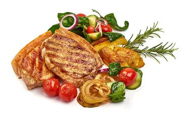 Roasted juicy pork steak with vegetables, fried meat, isolated on white background