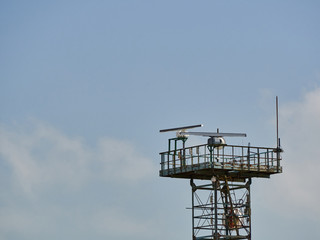 Tower with antennas and repeaters against the sky