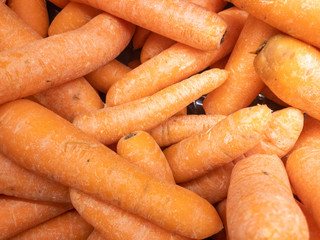 A pile of carrots in a supermarket