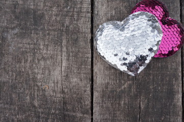 Two hearts on a wooden background a symbol of Valentine's Day
