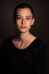portrait of young woman, fashion beautiful model, brunette girl with short hair in studio, close...