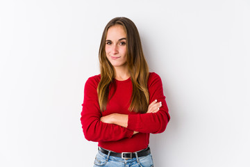 Young caucasian woman posing isolated  frowning face in displeasure, keeps arms folded.