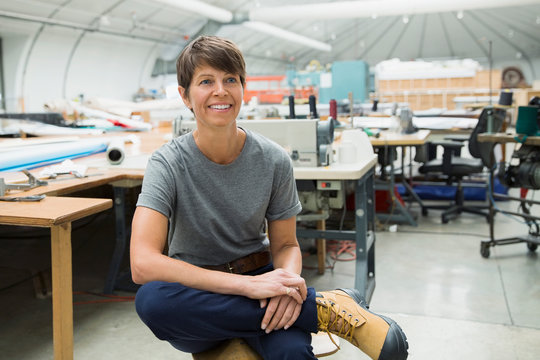 Smiling Worker In Textile Manufacturing Plant