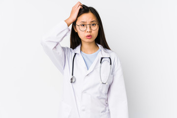 Young doctor chinese woman isolated being shocked, she has remembered important meeting.