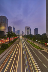 Fototapeta na wymiar Light trails on the busy road of Jakarta business office center in the dusk