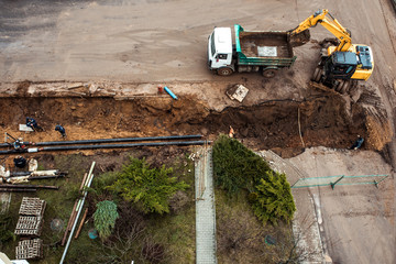 Repair of heating systems.Dug deep trench utilities engineering urban systems. Alarm urban sewerage . Repair work in the reconstruction of the urban road car.
