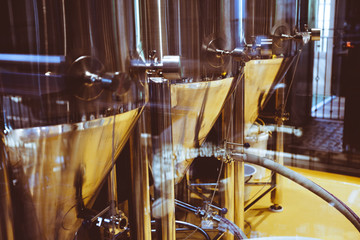 Brewery for production of beer. Alcohol industry business background. Stainless steel equipment for producing beer alcohol drink. Beer production brewery tanks. Beer tanks.