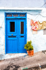 Fototapeta na wymiar Procida (Italy) - Colored walls of houses in Procida, a little island in Campania, southern Italy