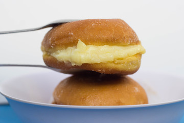 Krapfen, doughnut, donut with cream and sugar. Known in Brazil as a bread bakery dream. In portuguese 