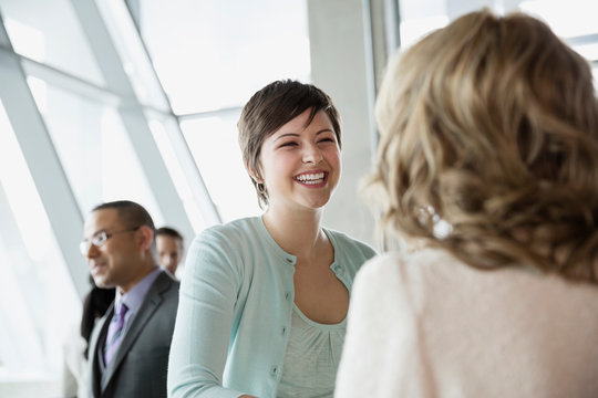 Businesswoman talking to colleague in office