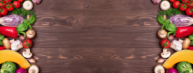 Various healthy products on wooden background with space for text. Banner of Healthy food. Organic food for healthy nutrition. Long banner format.