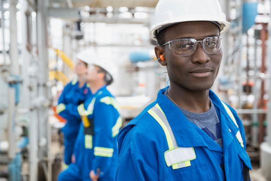 Portrait of confident worker at gas plant