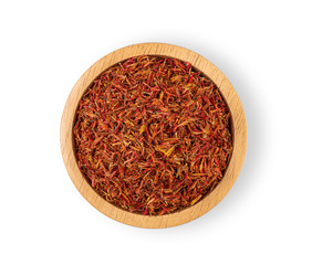 Fototapeta na wymiar Safflower in a wooden bowl on a white background, top view