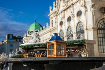 Fototapeta na wymiar street candlestick on a table in front of the Belvedere Palace complex in Vienna, Austria.