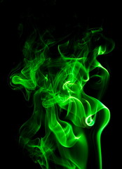 Obraz premium Green smoke on black background