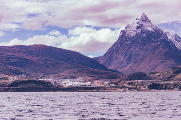 city in mountains and lake