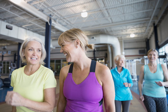 Smiling Women Walking On Gym Track