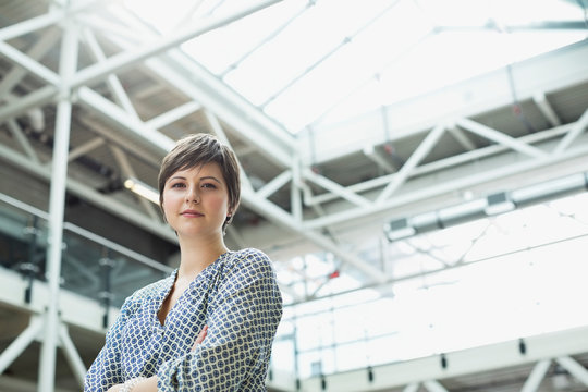 Portrait of businesswoman standing in office building