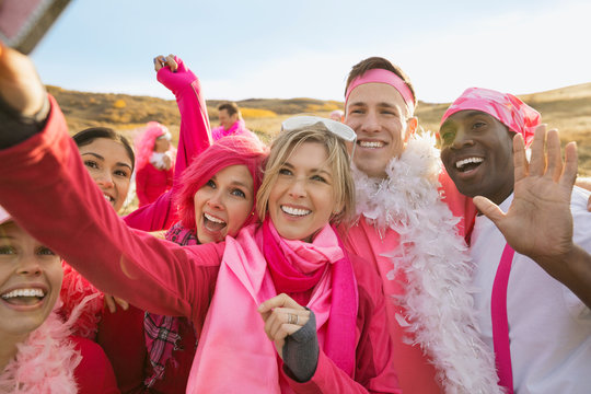 Group In Pink Taking Selfie At Charity Race