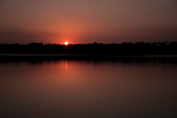 Naklejka premium sunset over lake
