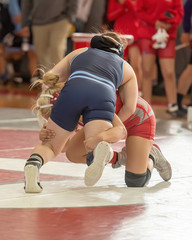 Naklejka premium High School wrestlers competing at a wrestling meet