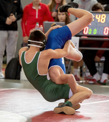 High School wrestlers competing at a wrestling meet