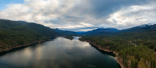Fototapeta premium Aerial Panoramic View of Daisy Lake and Sea to Sky Highway in the Canadian Mountain Landscape. Taken near Whistler and Squamish, North of Vancouver, BC, Canada.