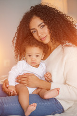 Love of a mother and baby. Family at home. Lifestyle